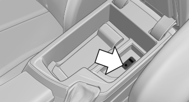 The AUX-IN port is located in the center armrest.