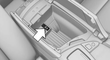 The AUX-IN port is located in the center armrest.