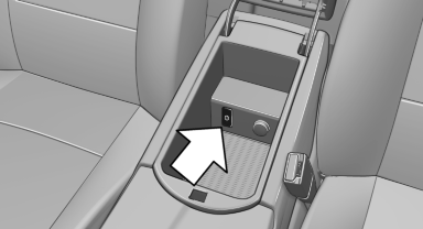 The AUX-IN port is located in the center armrest.