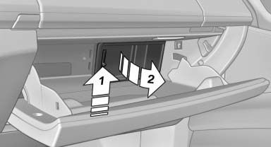 Push the handle up, arrow 1, and open the lid,